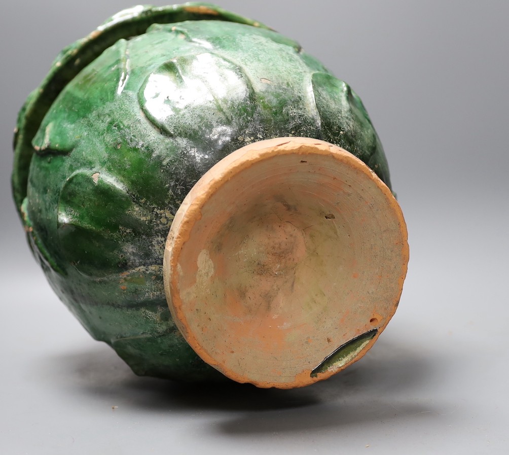 A Buddhist green glazed pottery jar and cover, 10th - 13th century. Thermoluminescence analysis report included, 43cm